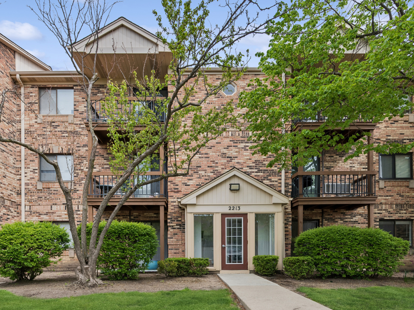 2213 West Nichols Road, Unit B Arlington Heights, IL 60004 - Photo 1 of 23 front view of a house with a yard