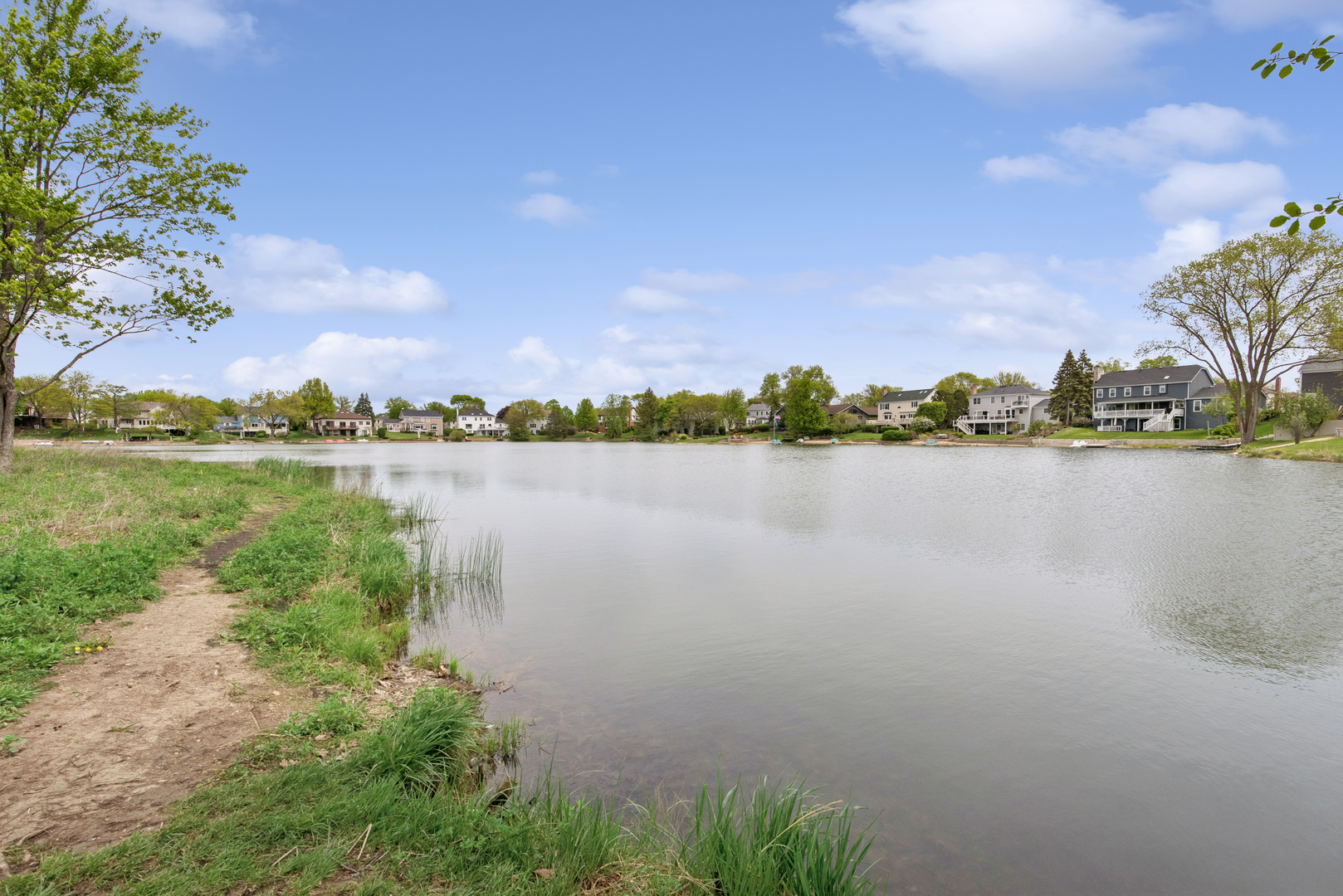 2213 West Nichols Road, Unit B Arlington Heights, IL 60004 - Photo 22 of 23 a view of a lake with houses in the back
