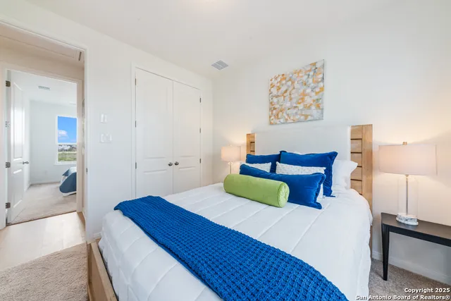 a bedroom with a bed and a view of bathroom