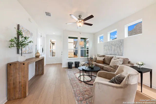a living room with furniture and a large window