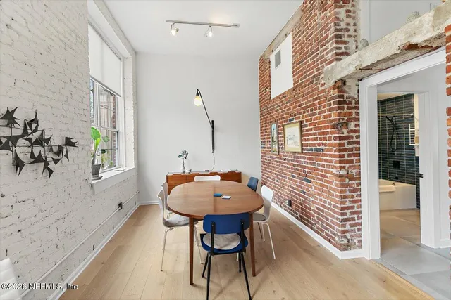 a bath room with a table and a chair