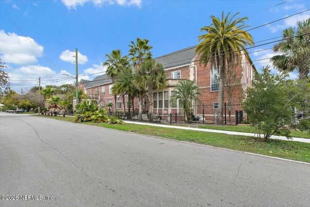 an aerial view of a house with a lake view