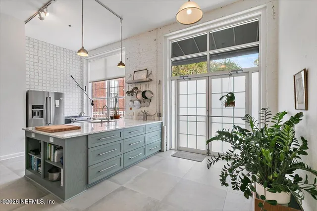 a kitchen with a table and chairs