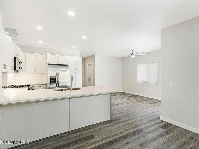 a view of kitchen with wooden floor