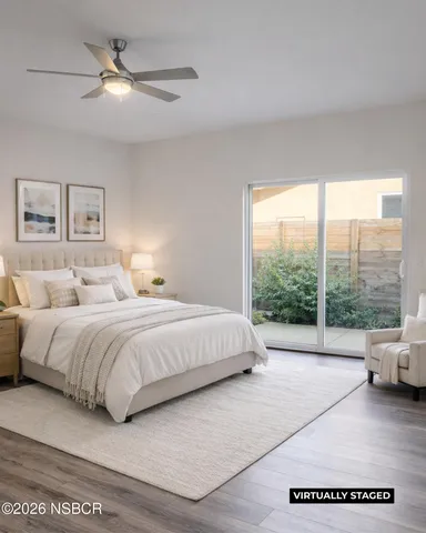 a spacious bedroom with a large bed and a large window