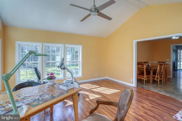 a view of a dining room with furniture window and wooden floor