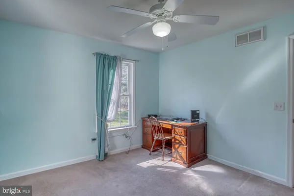 a room with furniture and window