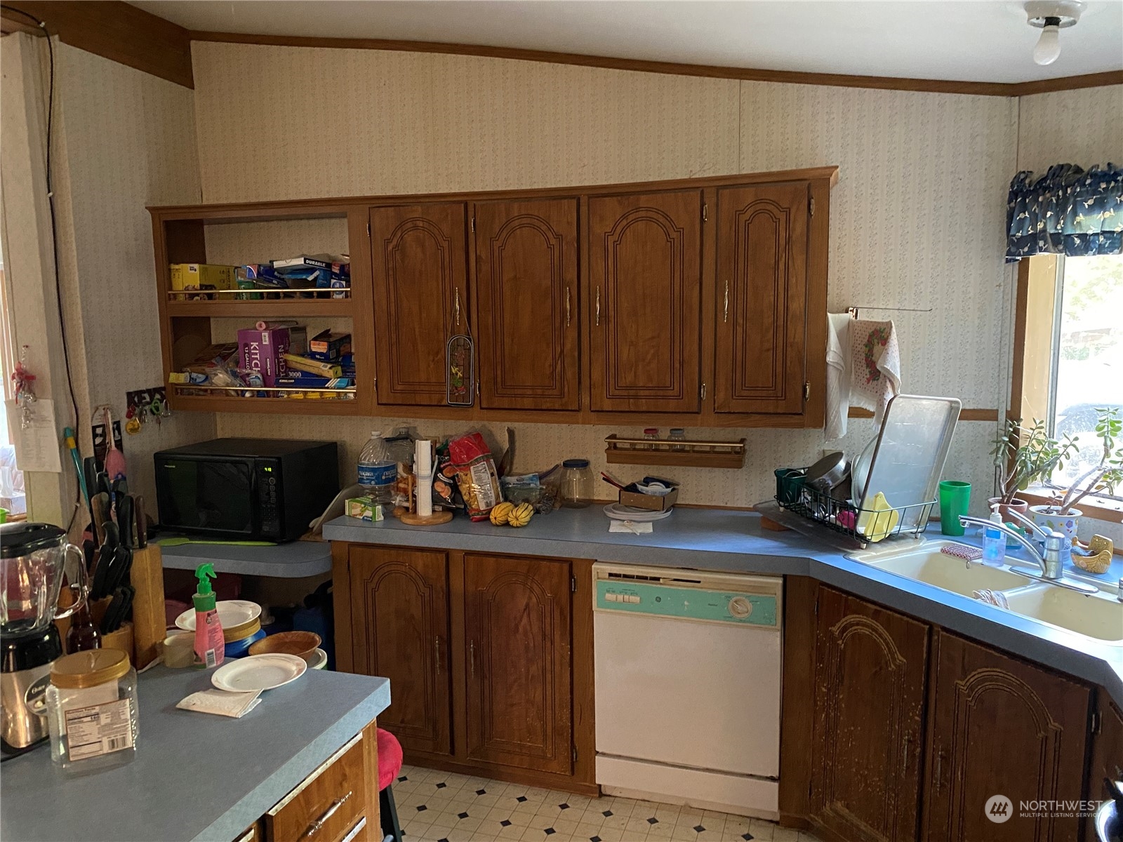 1425 East Victor Road Belfair, WA 98528 - Photo 16 of 19 a kitchen with stainless steel appliances a sink dishwasher stove and cabinets