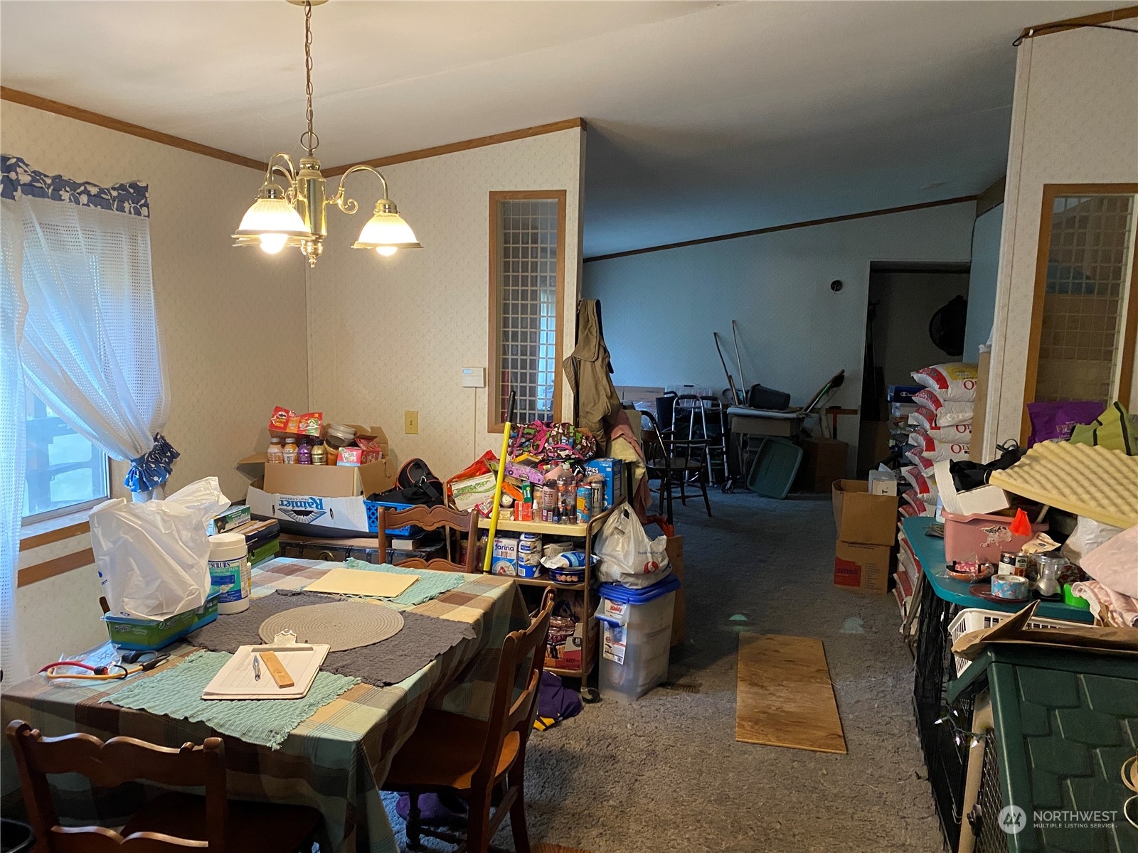 1425 East Victor Road Belfair, WA 98528 - Photo 17 of 19 a view of a dining room with furniture and a chandelier
