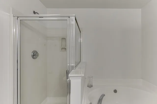 a bathroom with a sink double vanity and a mirror