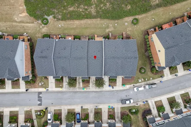 an aerial view of a house with a garden