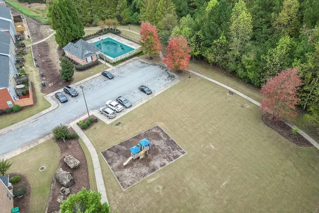 an aerial view of a house with outdoor space