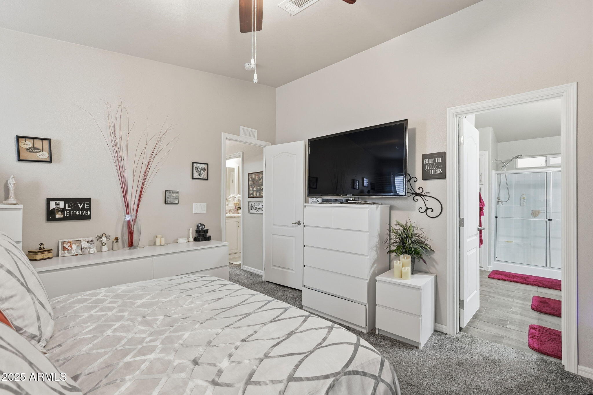 8865 East Baseline Road, Unit 130 Mesa, AZ 85209 - Photo 15 of 48 a bedroom with a bed and a flat screen tv