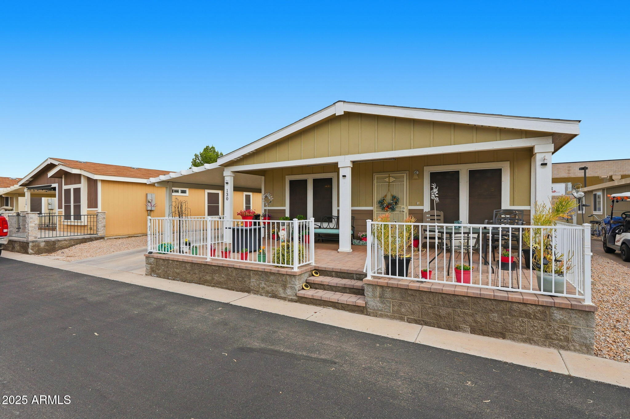 8865 East Baseline Road, Unit 130 Mesa, AZ 85209 - Photo 25 of 48 a view of a house with wooden deck