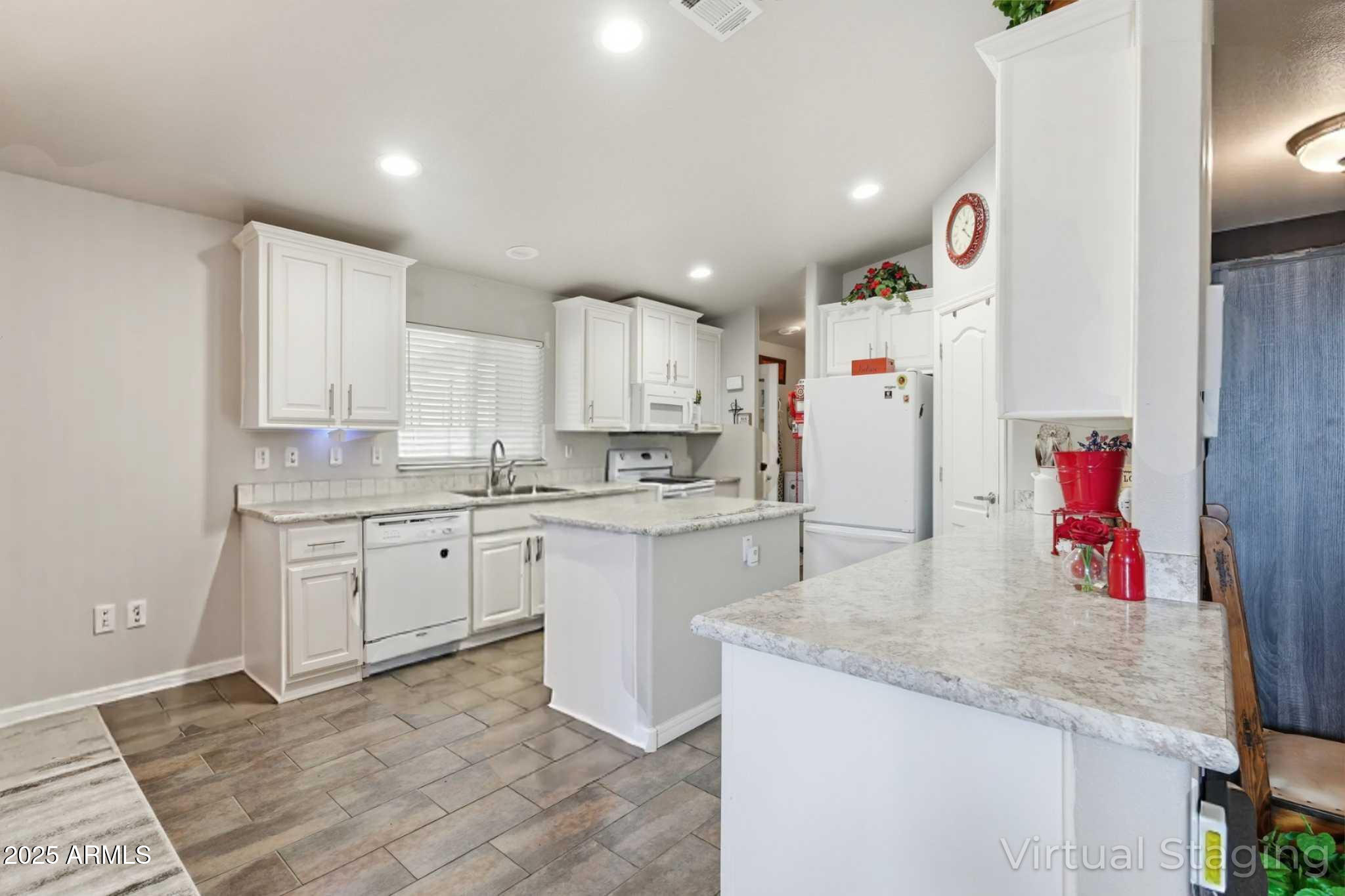 8865 East Baseline Road, Unit 130 Mesa, AZ 85209 - Photo 4 of 48 a kitchen with granite countertop cabinets and white appliances