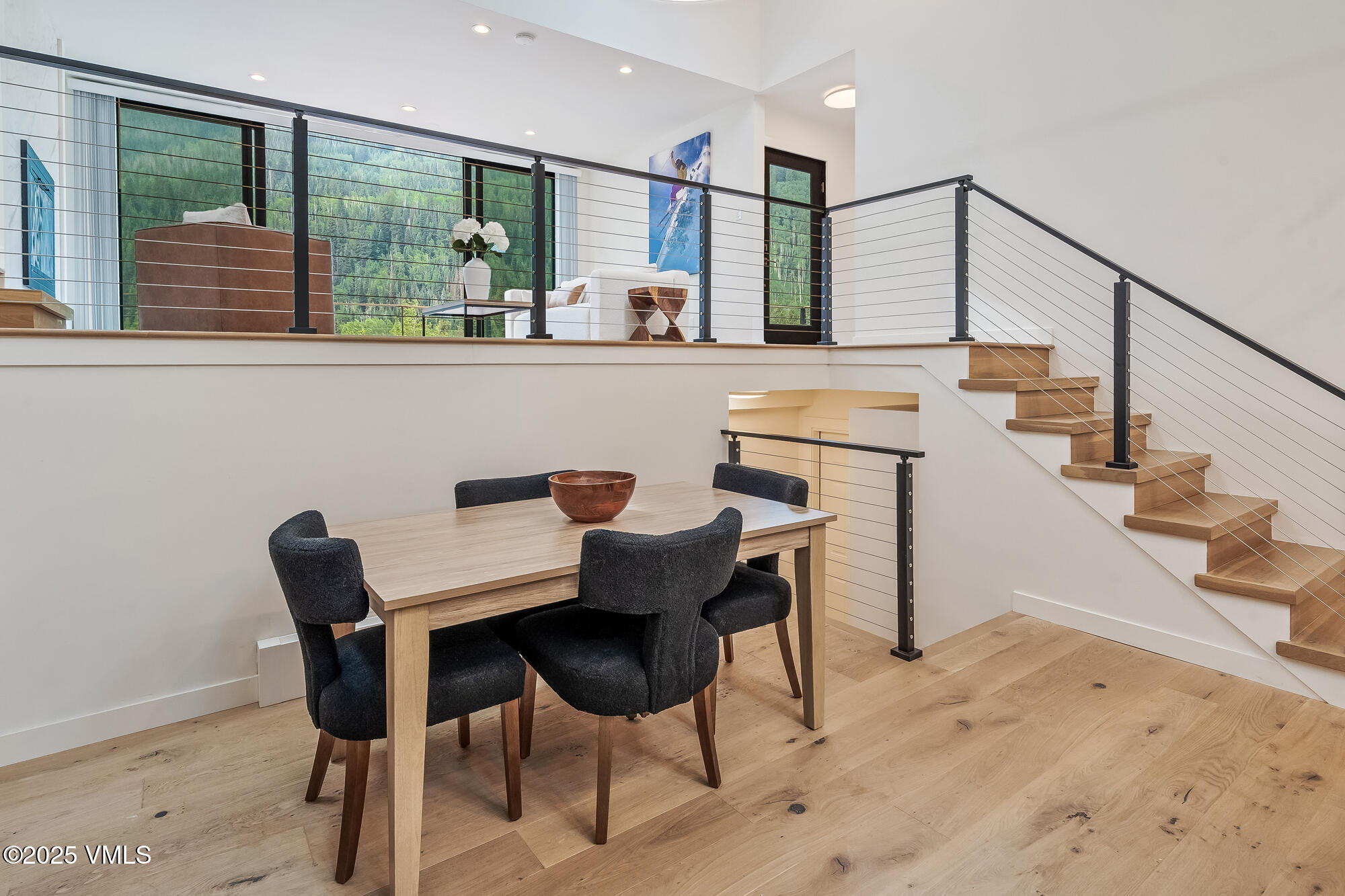 4545 Big Horn Road Vail, CO 81657 - Photo 14 of 49 a dining room with furniture and large windows