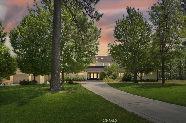 a view of house with a yard