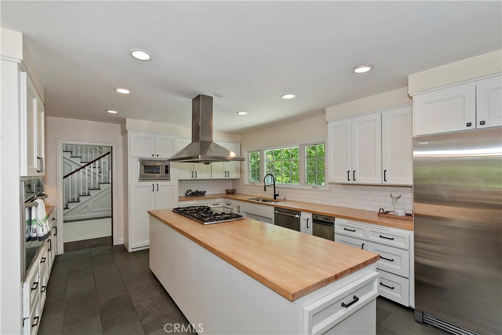28411 North Shore Road Lake Arrowhead, CA 92352 - Photo 16 of 66 a kitchen with stainless steel appliances granite countertop a stove a refrigerator and a sink