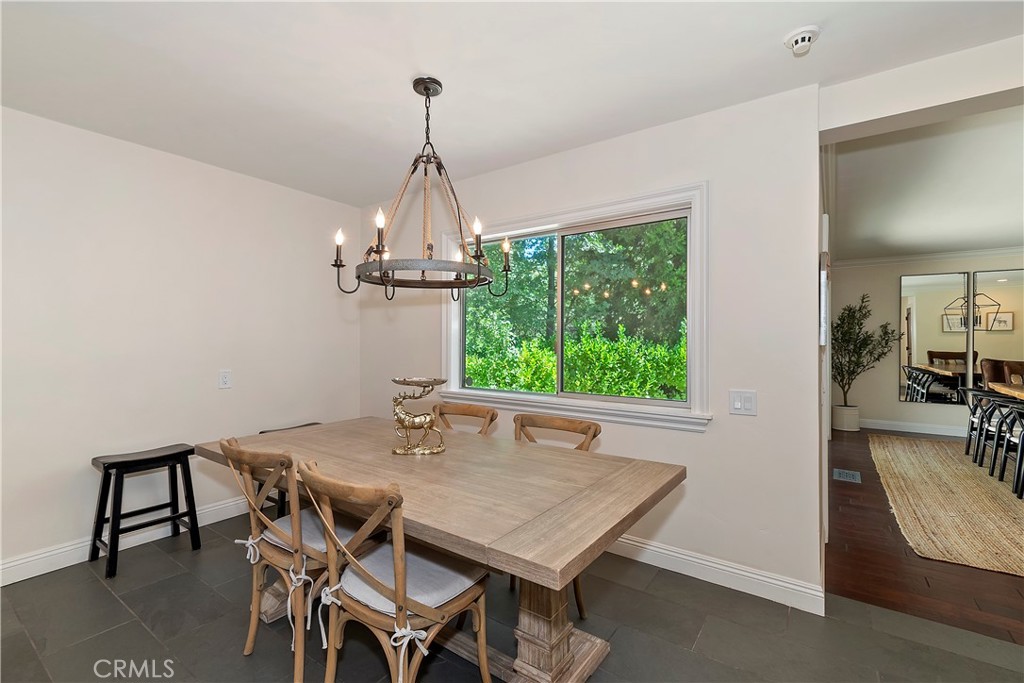 28411 North Shore Road Lake Arrowhead, CA 92352 - Photo 23 of 66 a view of a dining room with furniture window and wooden floor