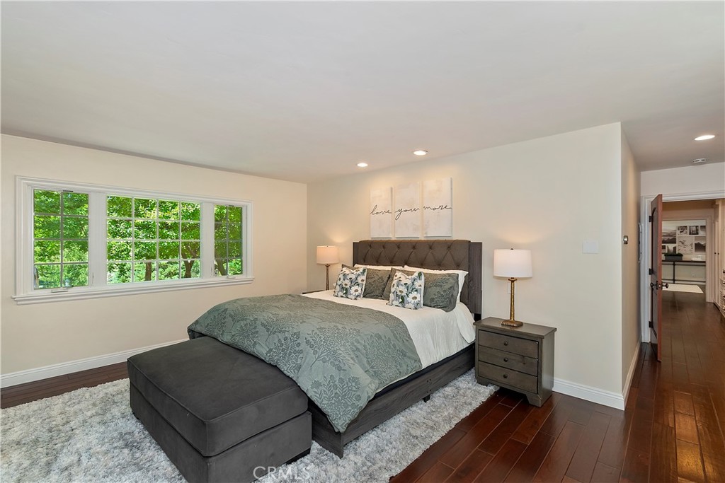 28411 North Shore Road Lake Arrowhead, CA 92352 - Photo 25 of 66 a bedroom with a bed and window