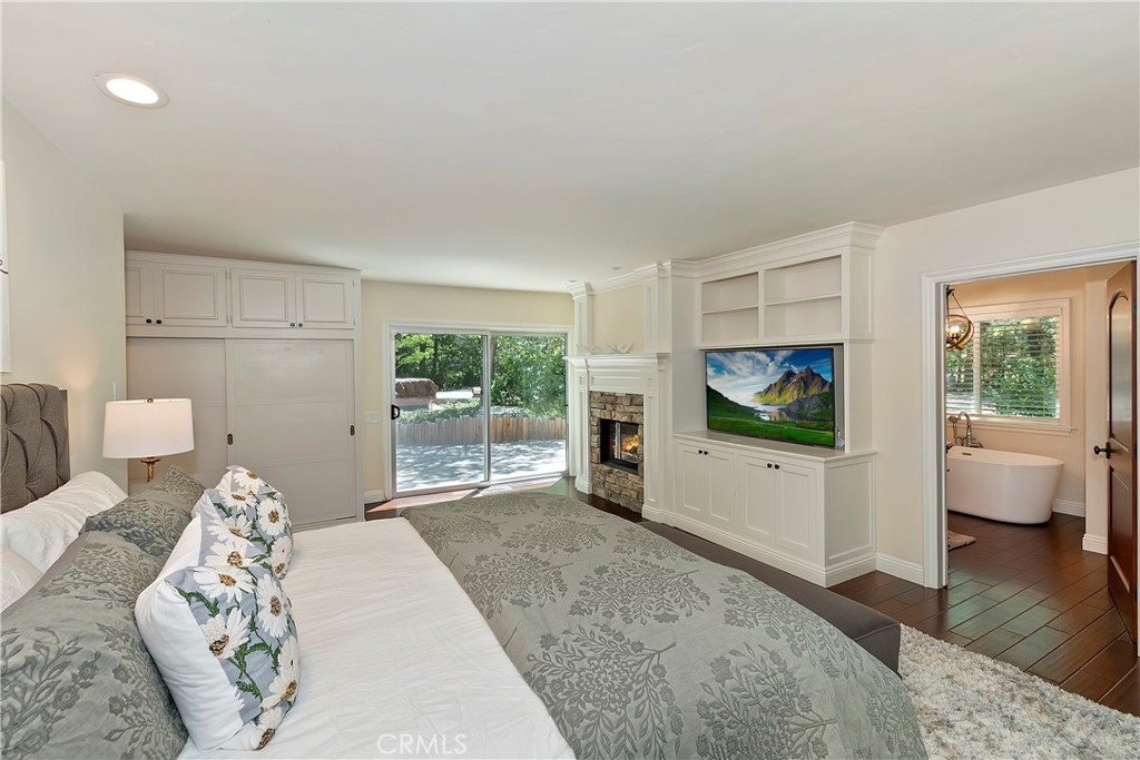 28411 North Shore Road Lake Arrowhead, CA 92352 - Photo 27 of 66 a bedroom with furniture and a flat screen tv