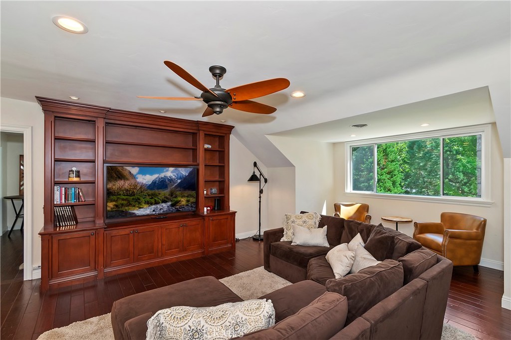 28411 North Shore Road Lake Arrowhead, CA 92352 - Photo 32 of 66 a living room with furniture and a flat screen tv