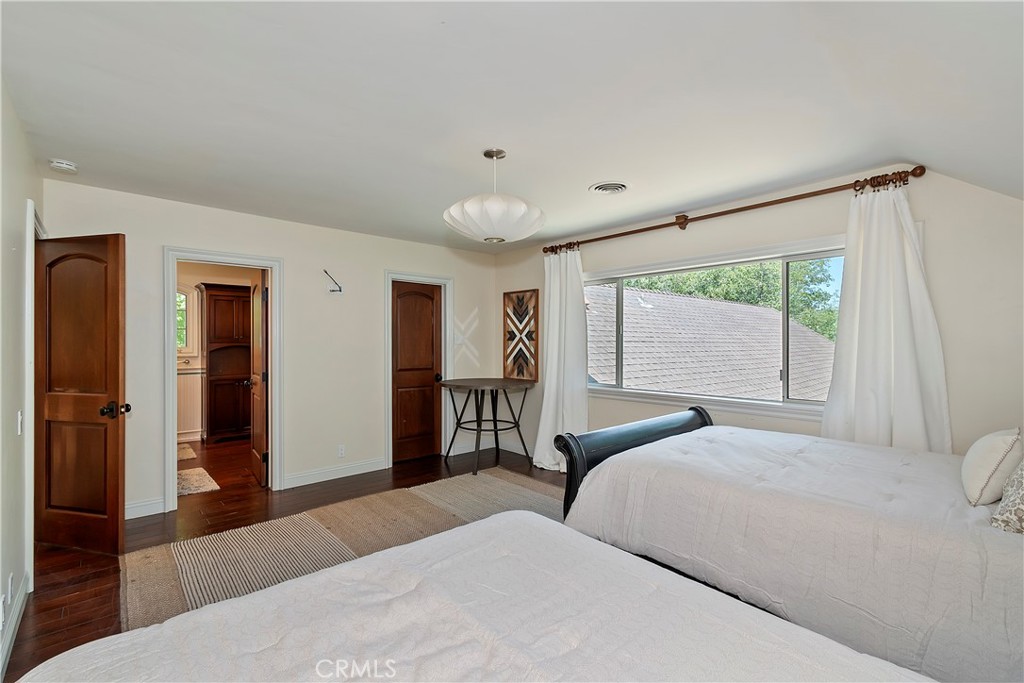 28411 North Shore Road Lake Arrowhead, CA 92352 - Photo 35 of 66 a bedroom with a large bed and a large window