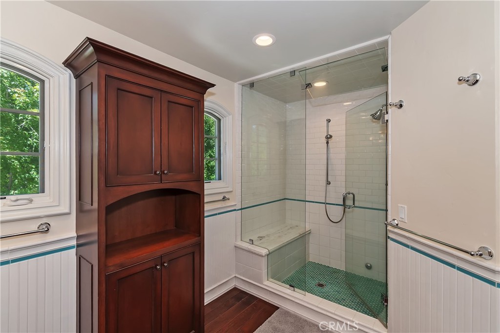 28411 North Shore Road Lake Arrowhead, CA 92352 - Photo 37 of 66 a bathroom with a glass shower door and a sink