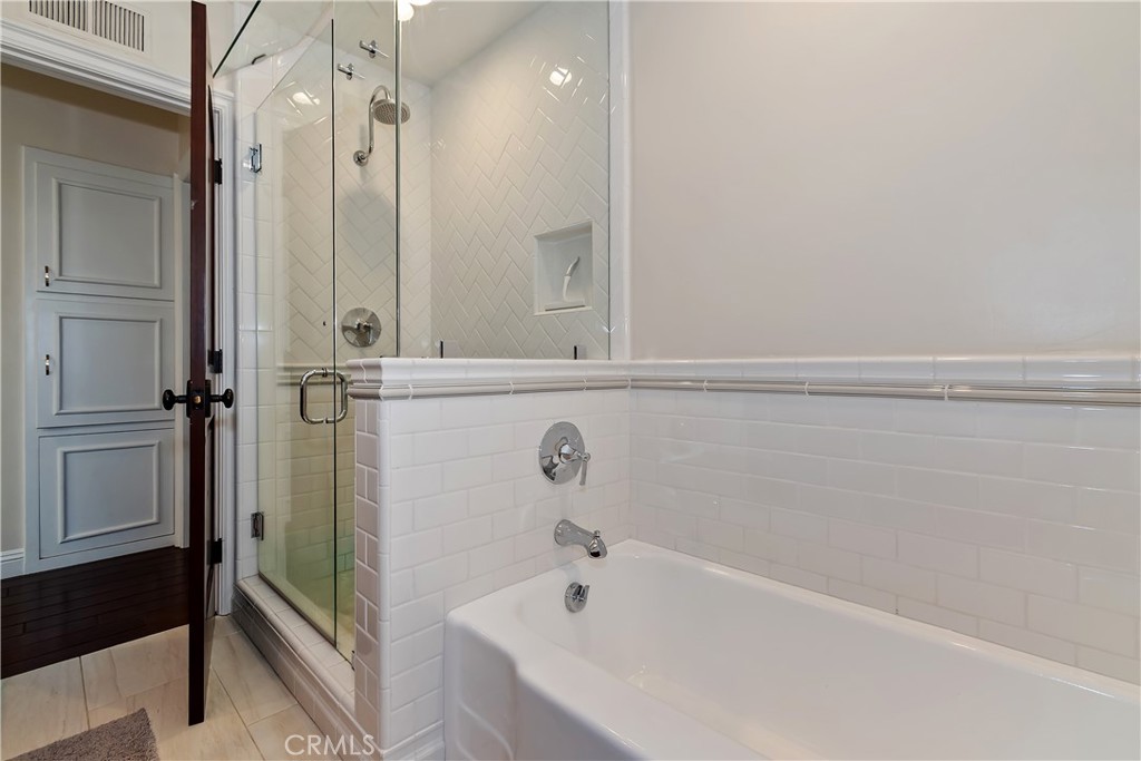 28411 North Shore Road Lake Arrowhead, CA 92352 - Photo 41 of 66 a bathroom with a bathtub and a shower