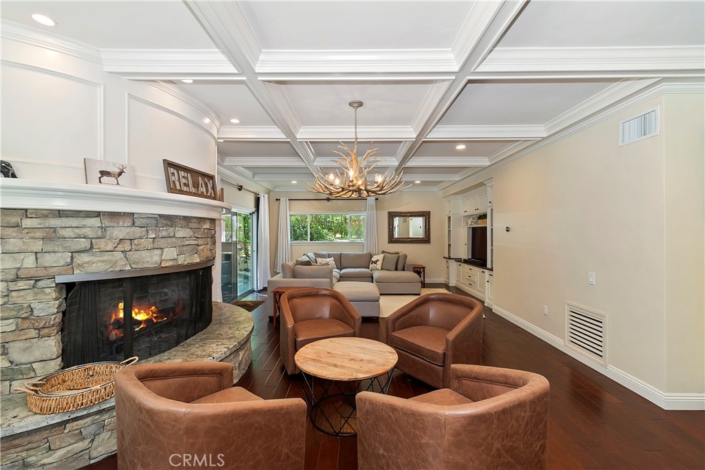 28411 North Shore Road Lake Arrowhead, CA 92352 - Photo 10 of 66 a living room with furniture a fireplace and a chandelier