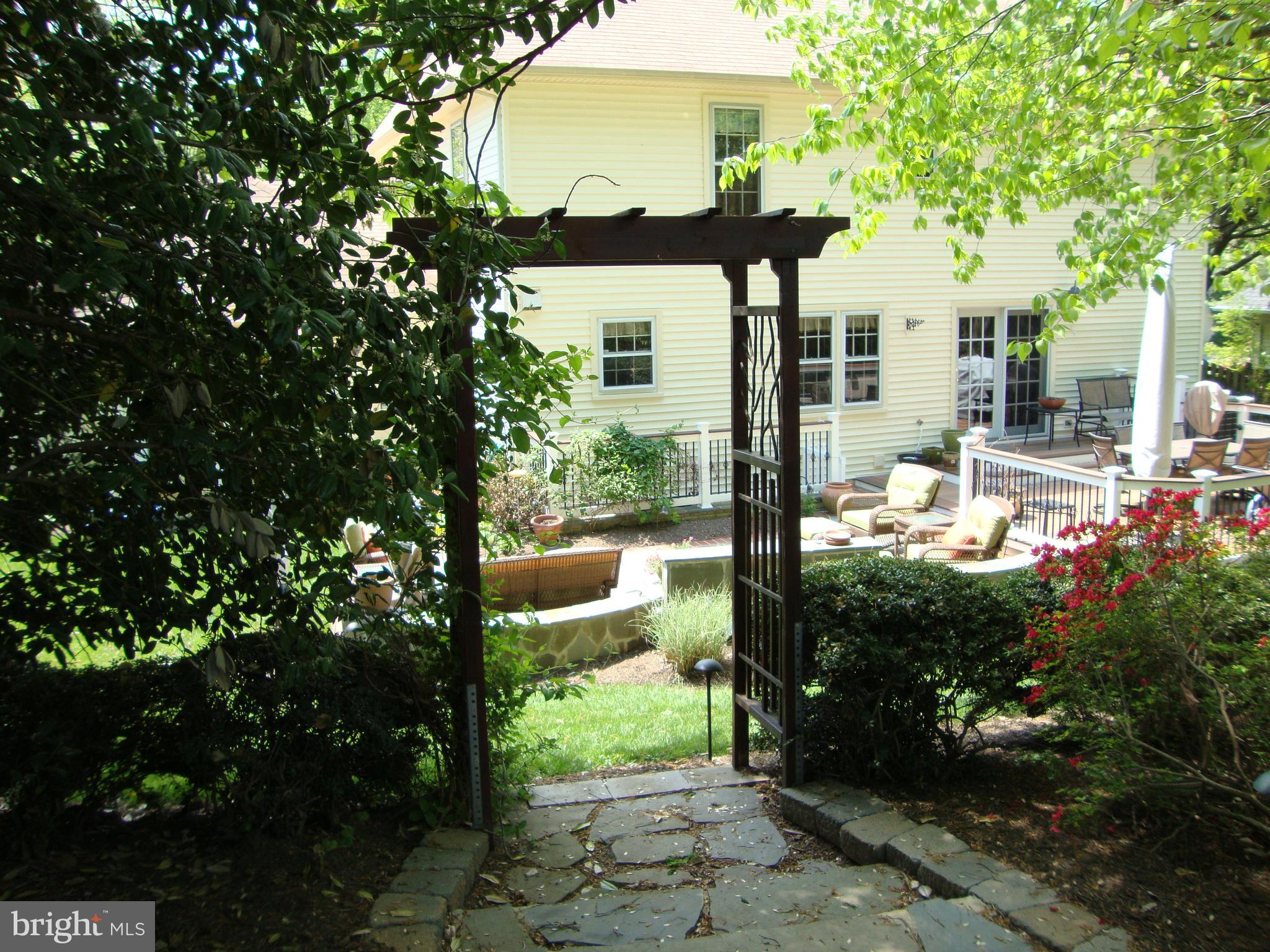 9302 Mac Swain Place Springfield, VA 22153 - Photo 64 of 69 Rear Yard Entrance to secluded trees and bench