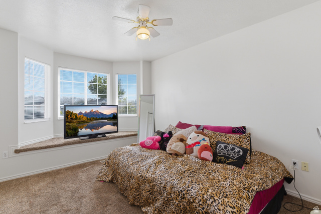 134 West 475 South Ogden, UT 84404 - Photo 17 of 27 Bedroom featuring dark carpet and a ceiling fan