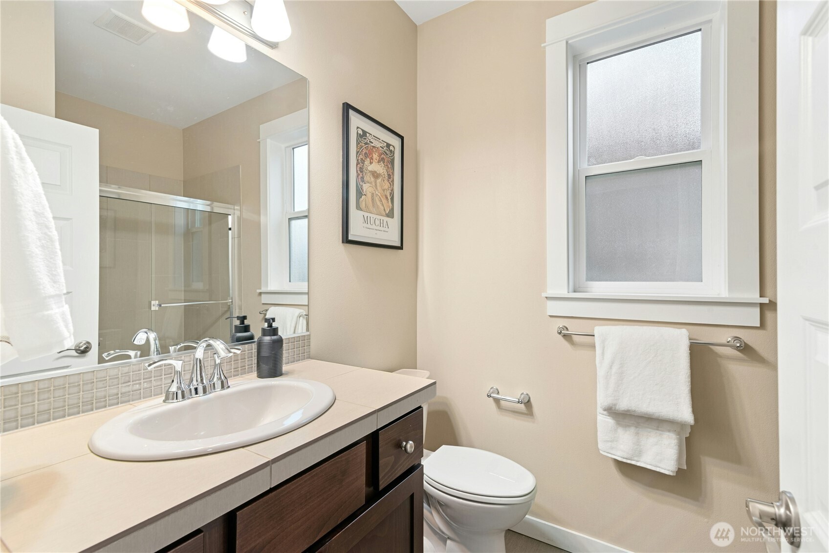 14713 98th Avenue Northeast Bothell, WA 98011 - Photo 14 of 40 a bathroom with a granite countertop toilet a sink and a mirror