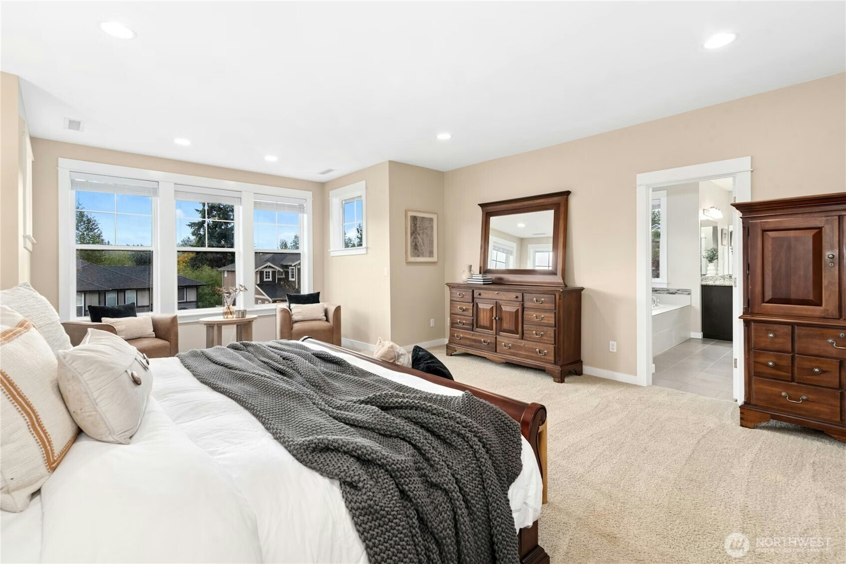 14713 98th Avenue Northeast Bothell, WA 98011 - Photo 17 of 40 a bedroom with a bed a couch and large window