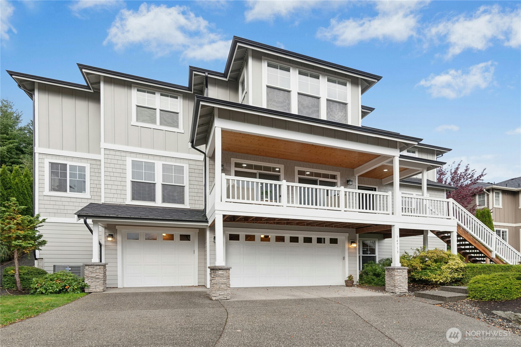 14713 98th Avenue Northeast Bothell, WA 98011 - Photo 2 of 40 a front view of a house with a garage