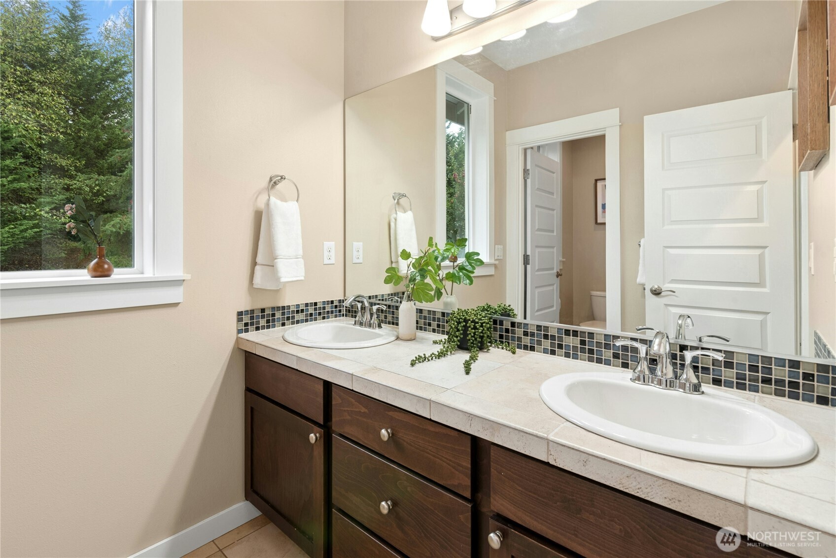 14713 98th Avenue Northeast Bothell, WA 98011 - Photo 26 of 40 a bathroom with a sink and a mirror