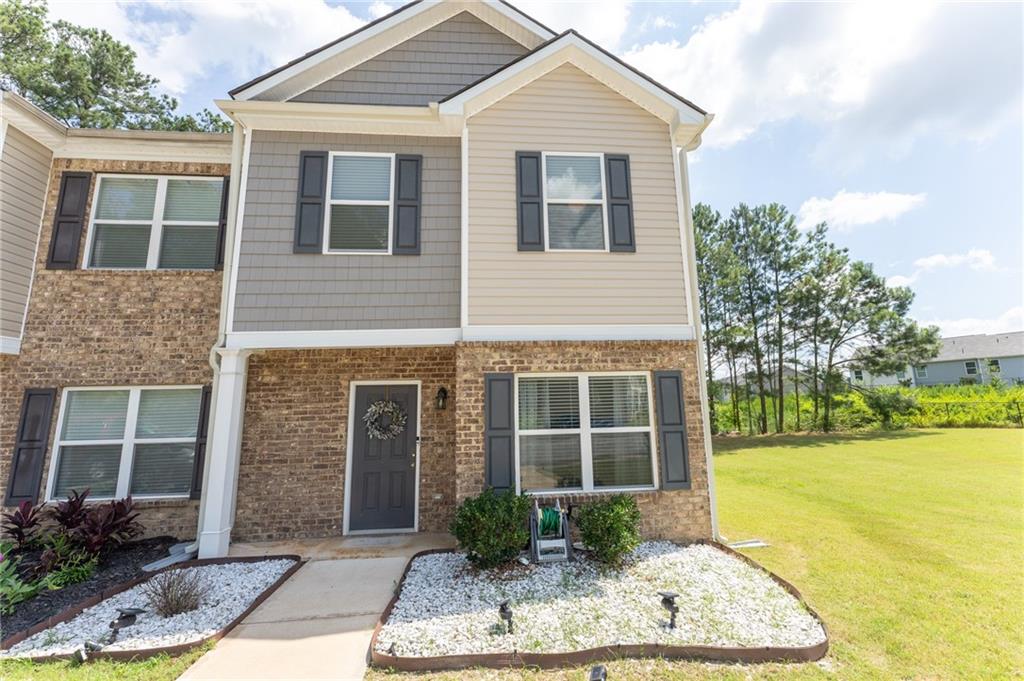 6020 Oakley Road Union City, GA 30291 - Photo 1 of 1 a front view of a house with garden