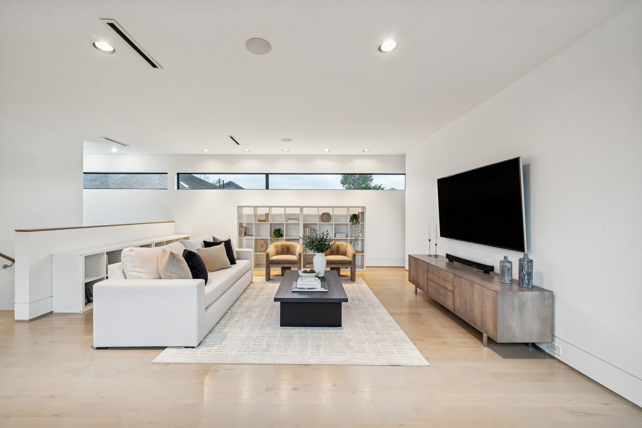 2332 Wroxton Road Houston, TX 77005 - Photo 26 of 50 a living room with furniture and a flat screen tv