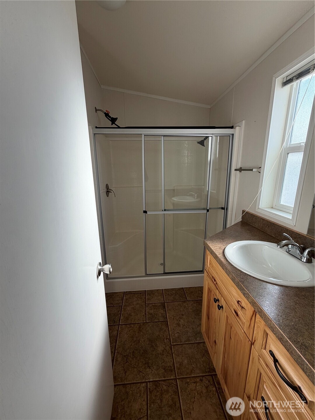 87 Canyon Creek Road Oroville, WA 98844 - Photo 12 of 24 a bathroom with a sink a toilet and shower