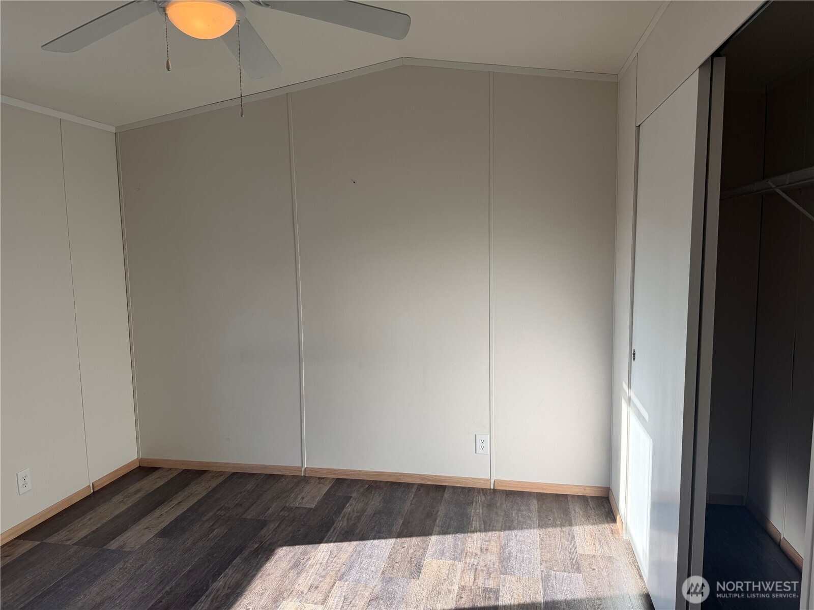 87 Canyon Creek Road Oroville, WA 98844 - Photo 15 of 24 a view of an empty room and wooden floor