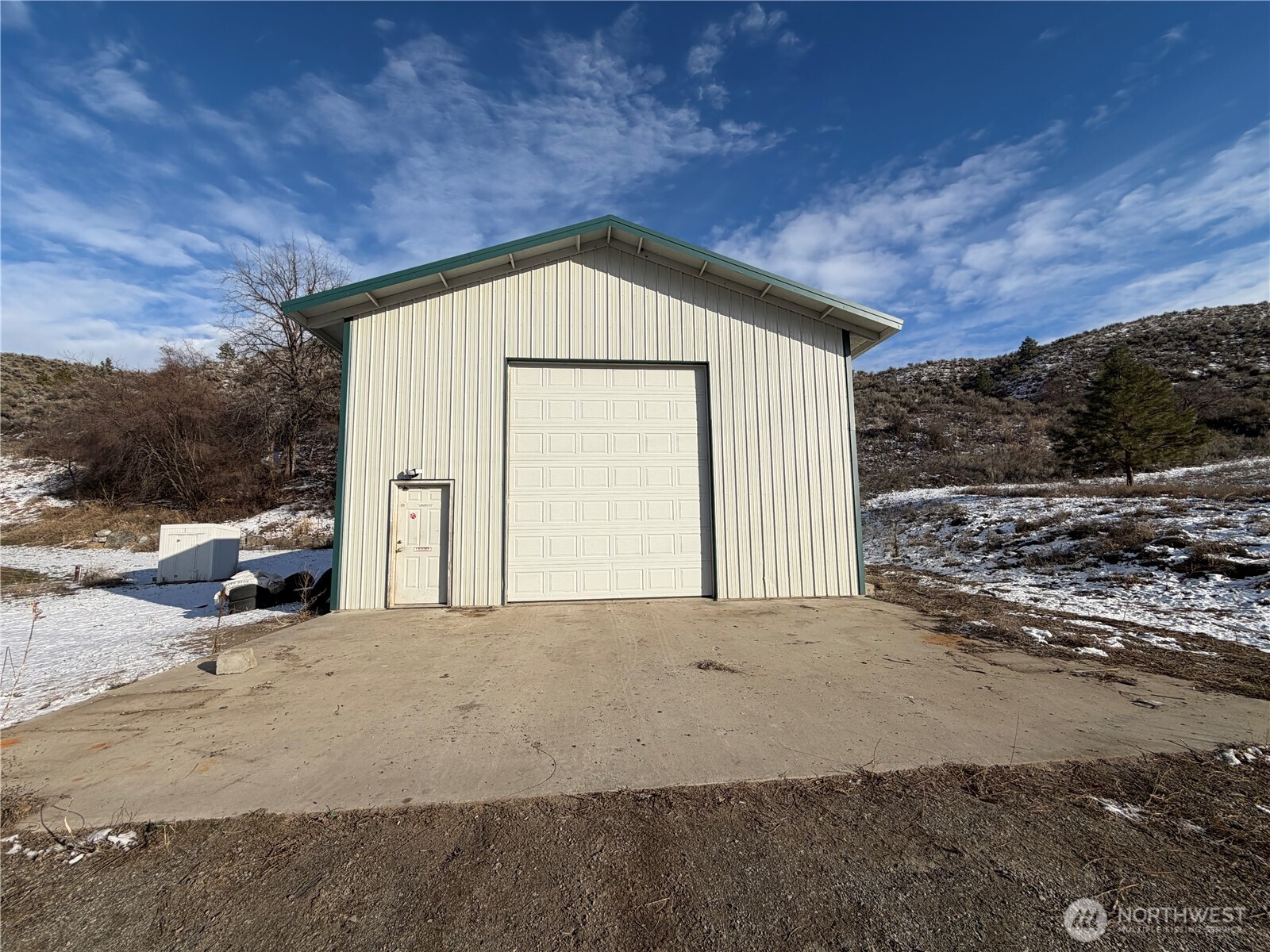 87 Canyon Creek Road Oroville, WA 98844 - Photo 17 of 24 a view of a house with a yard