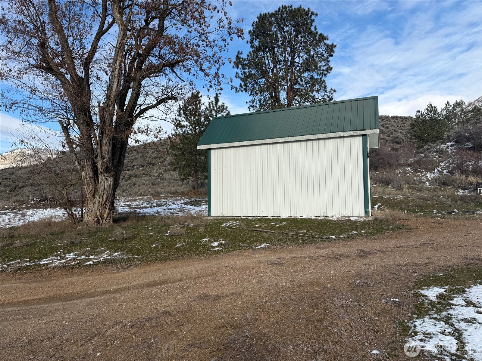 87 Canyon Creek Road Oroville, WA 98844 - Photo 18 of 24 a view of a house with a tree