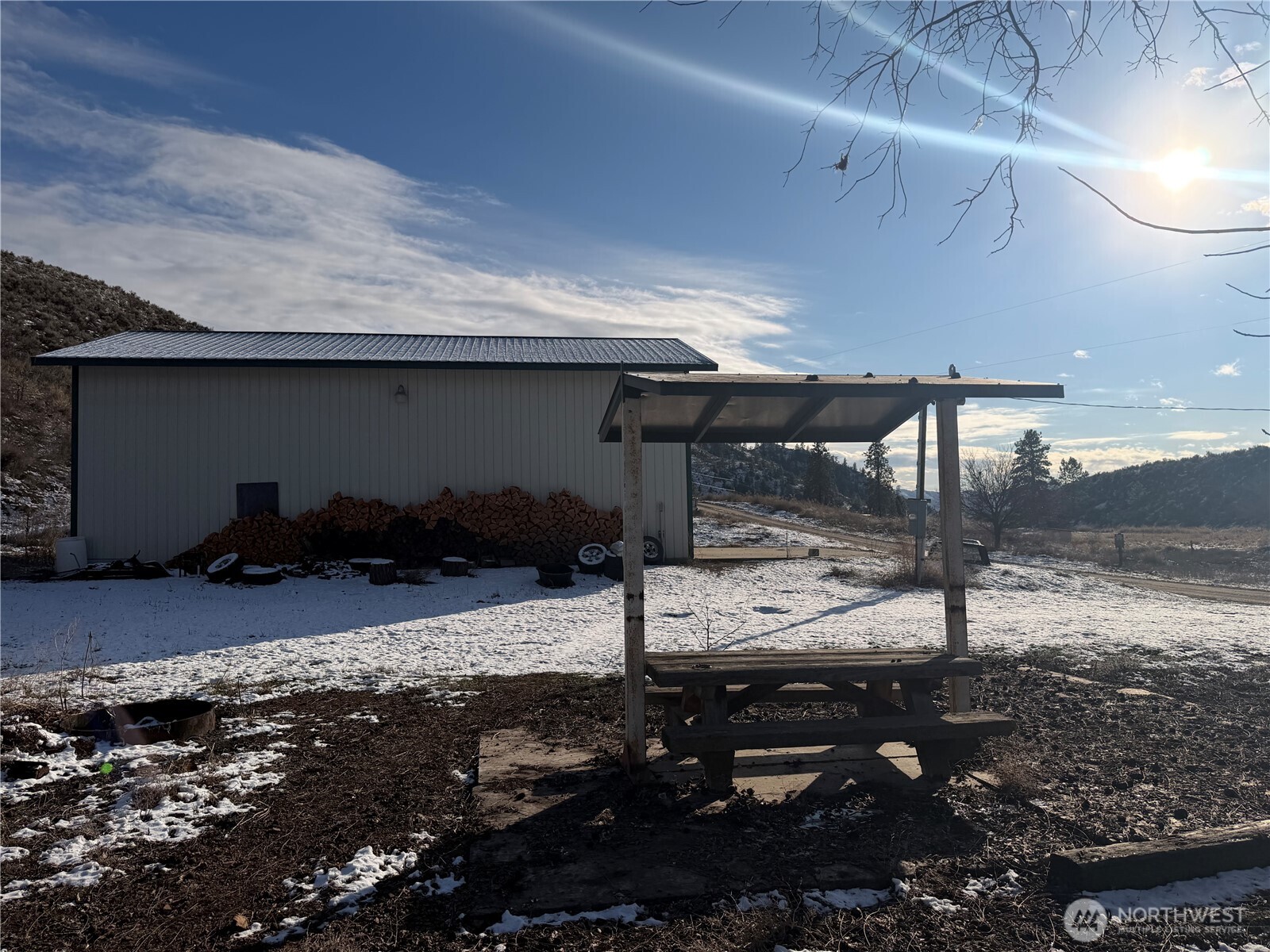 87 Canyon Creek Road Oroville, WA 98844 - Photo 19 of 24 a street view with parking