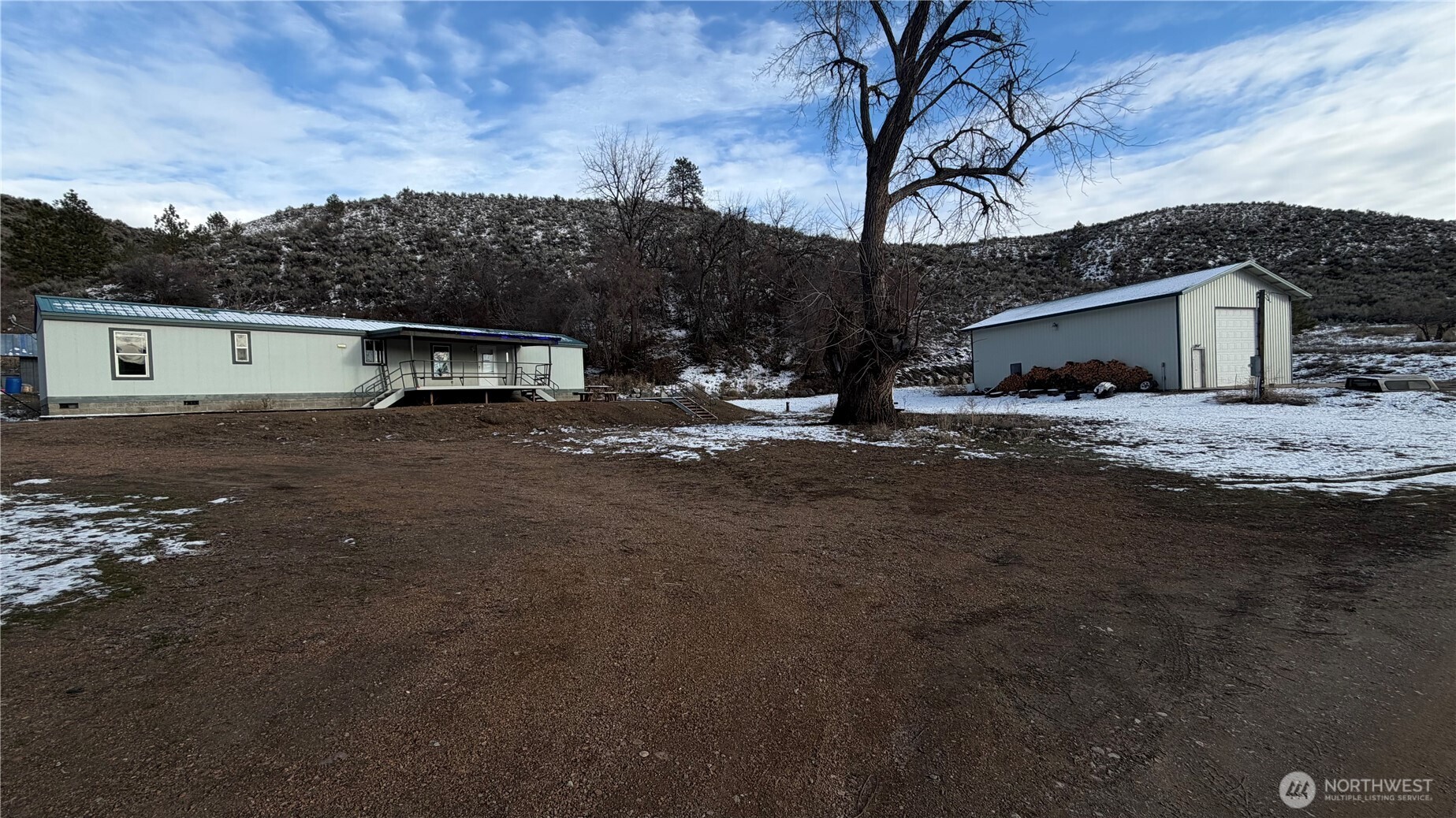 87 Canyon Creek Road Oroville, WA 98844 - Photo 20 of 24 a view of a house with a yard