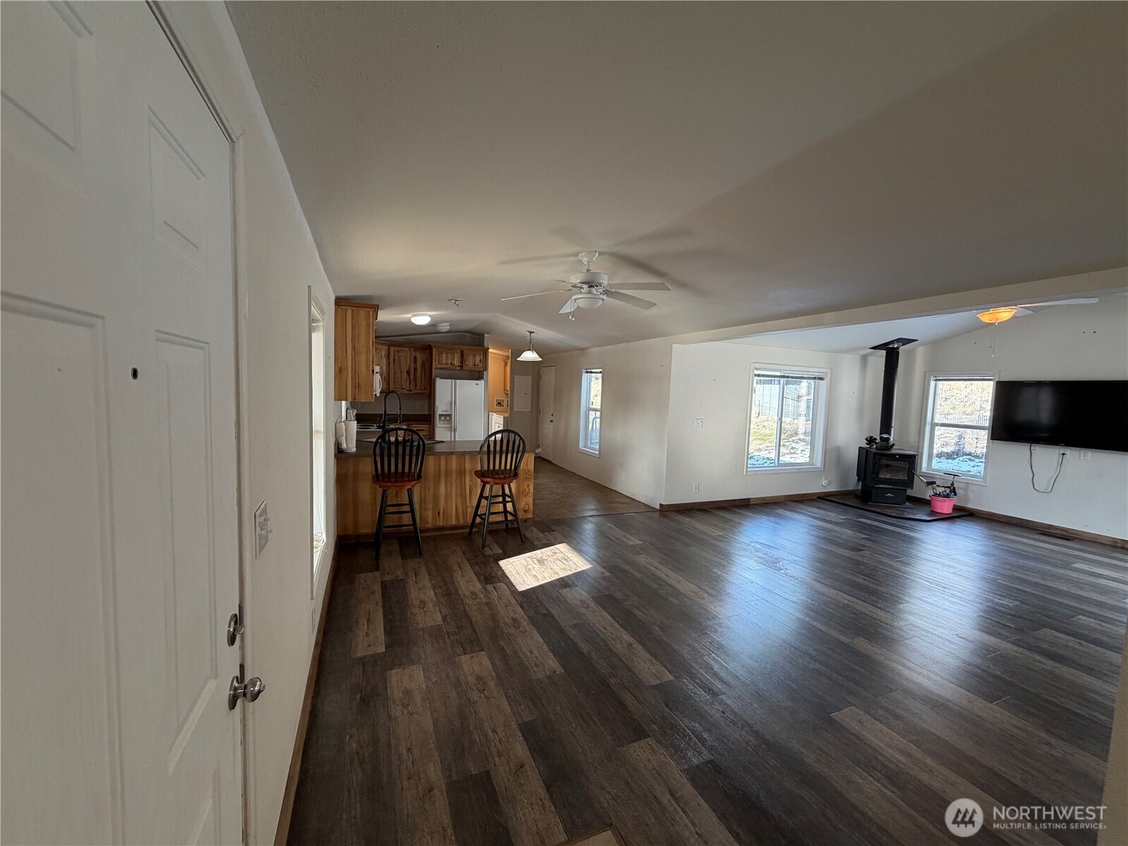 87 Canyon Creek Road Oroville, WA 98844 - Photo 2 of 24 a view of a livingroom with wooden floor and furniture