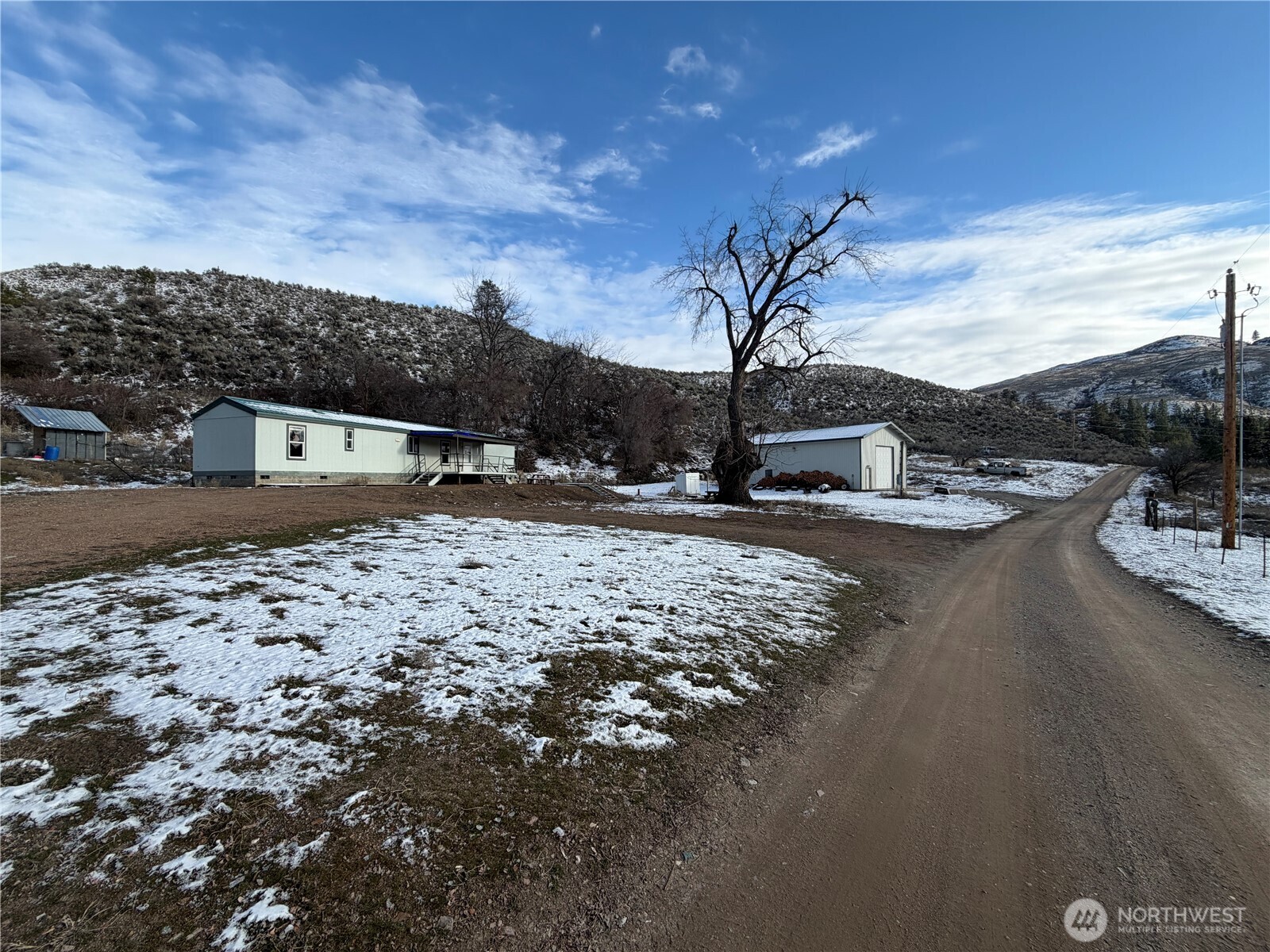 87 Canyon Creek Road Oroville, WA 98844 - Photo 21 of 24 a view of a backyard of the house