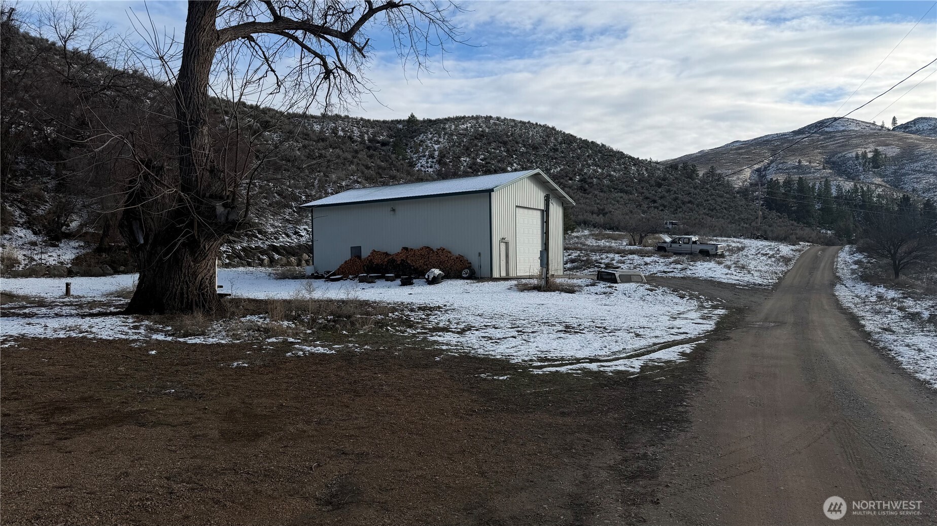 87 Canyon Creek Road Oroville, WA 98844 - Photo 23 of 24 a view of a house with a snow