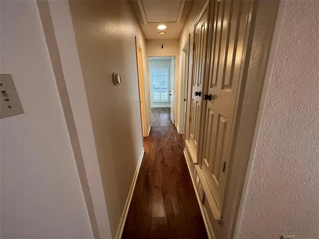 a view of a house with cars park