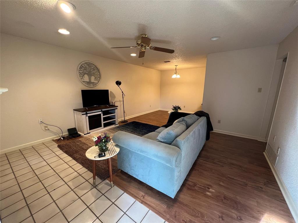 3129 Sappington Place Fort Worth, TX 76116 - Photo 6 of 15 a living room with furniture and a wooden floor