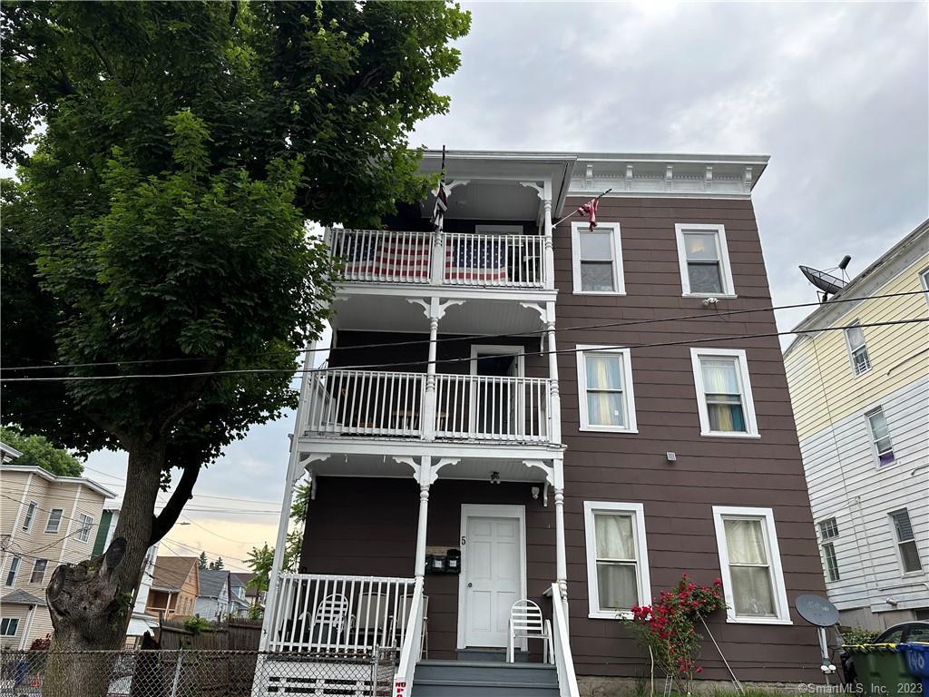 5 Rye Street Waterbury, CT 06706 - Photo 1 of 1 a front view of a house with a yard
